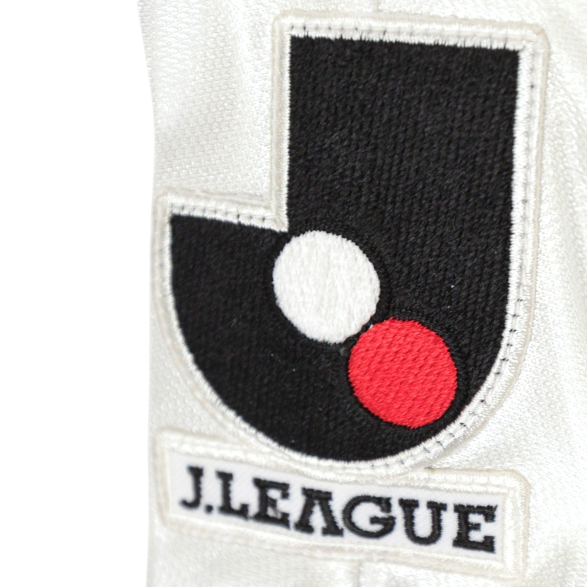 Close-up of the J.League badge stitched on the sleeve