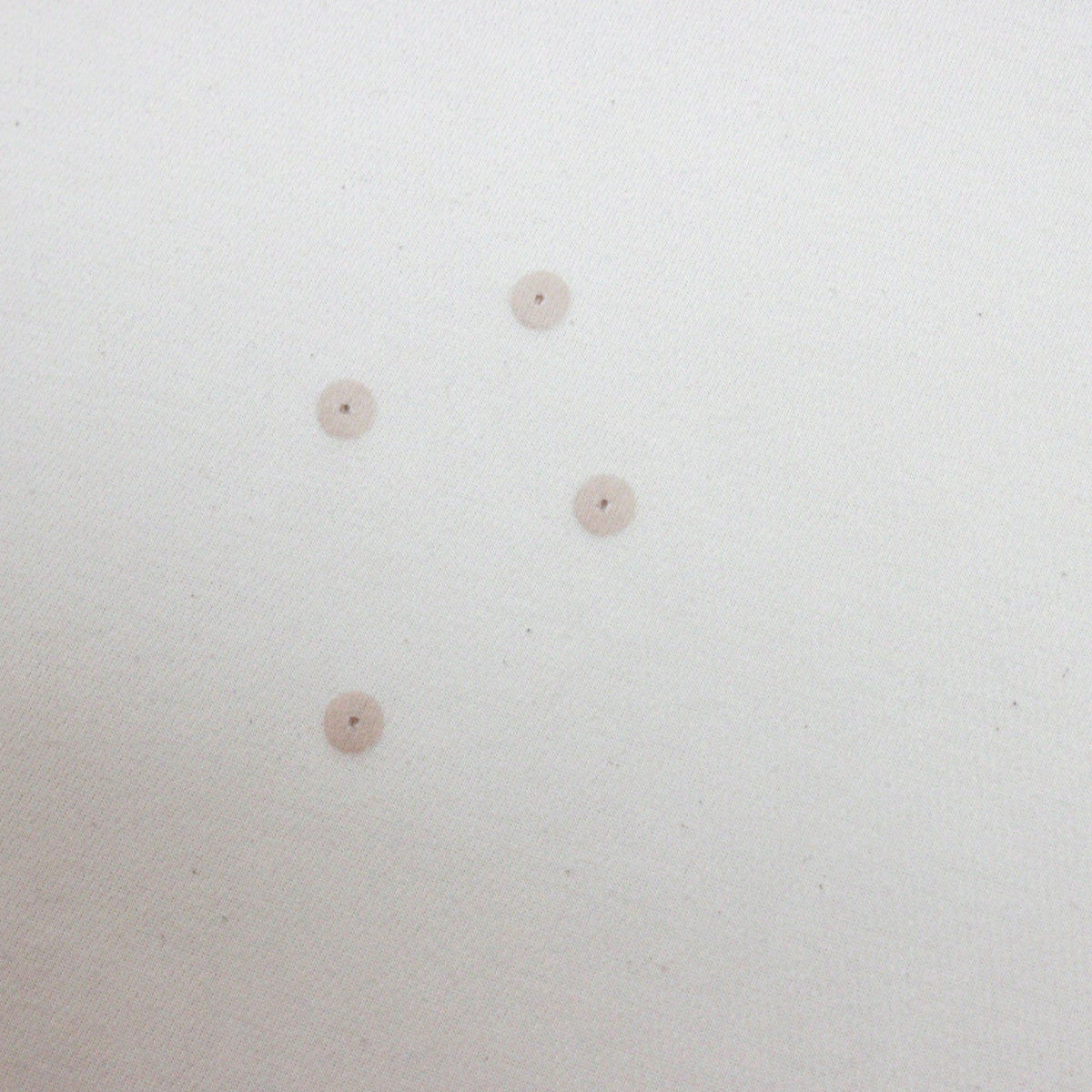 Close-up of faint marks on the back of the England shirt