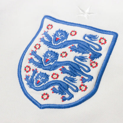 Close-up of the embroidered three lions crest and star on the chest