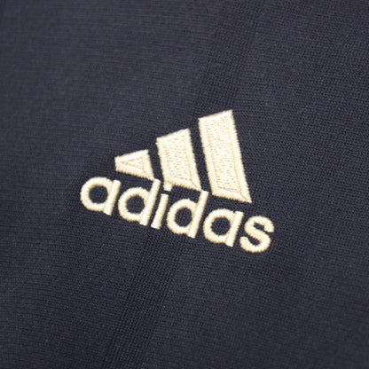 Close-up of the adidas logo embroidered on the chest of the Germany away shirt