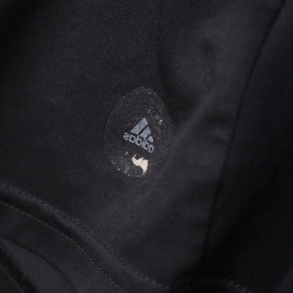Close-up of the faded inner size label reading adidas and M on the Germany away shirt