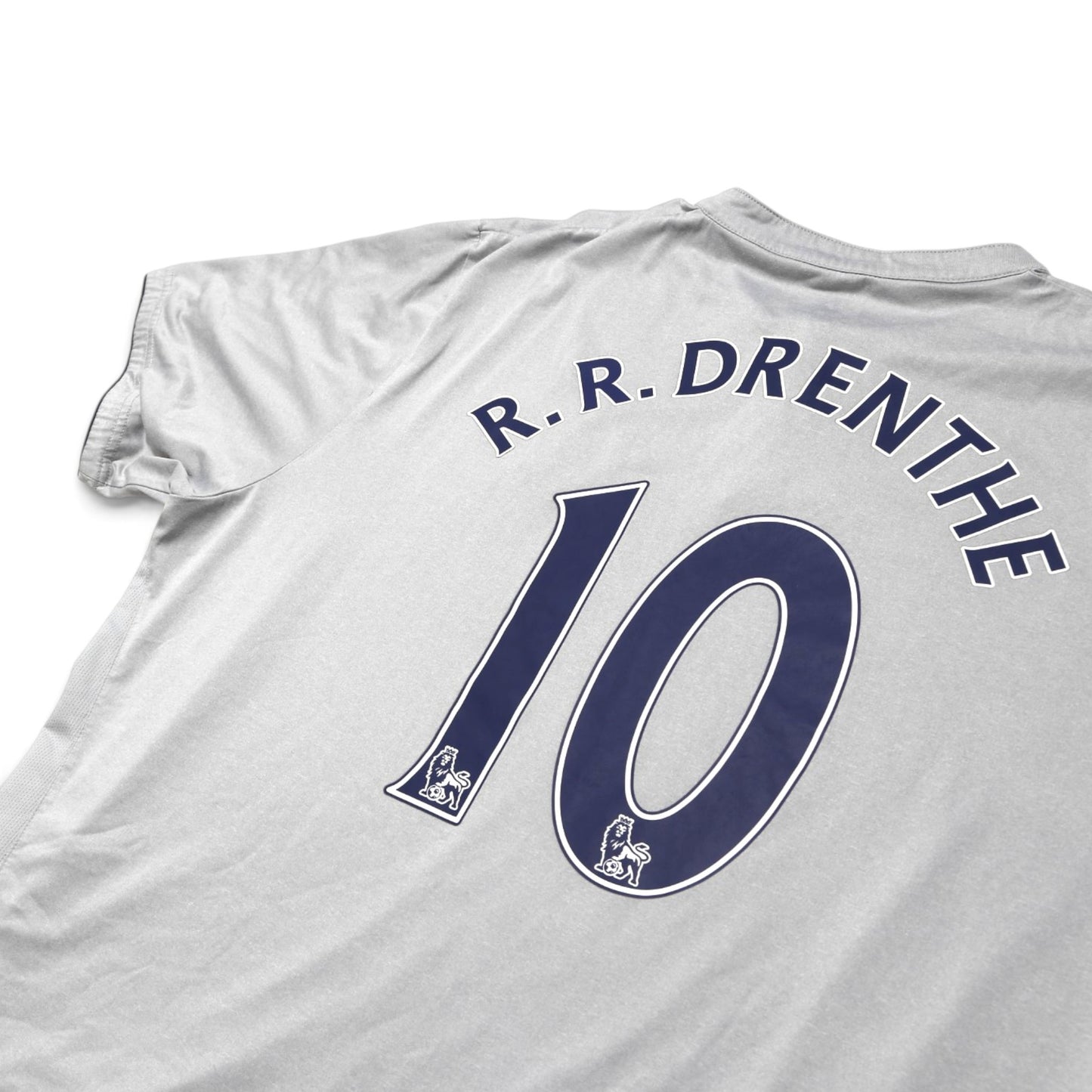 Close-up of Everton shirt collar and shoulder showing Drenthe #10 print and fabric texture