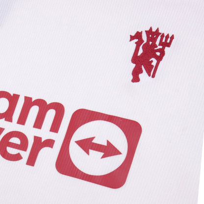 Close-up of Manchester United crest and TeamViewer sponsor print on third shirt