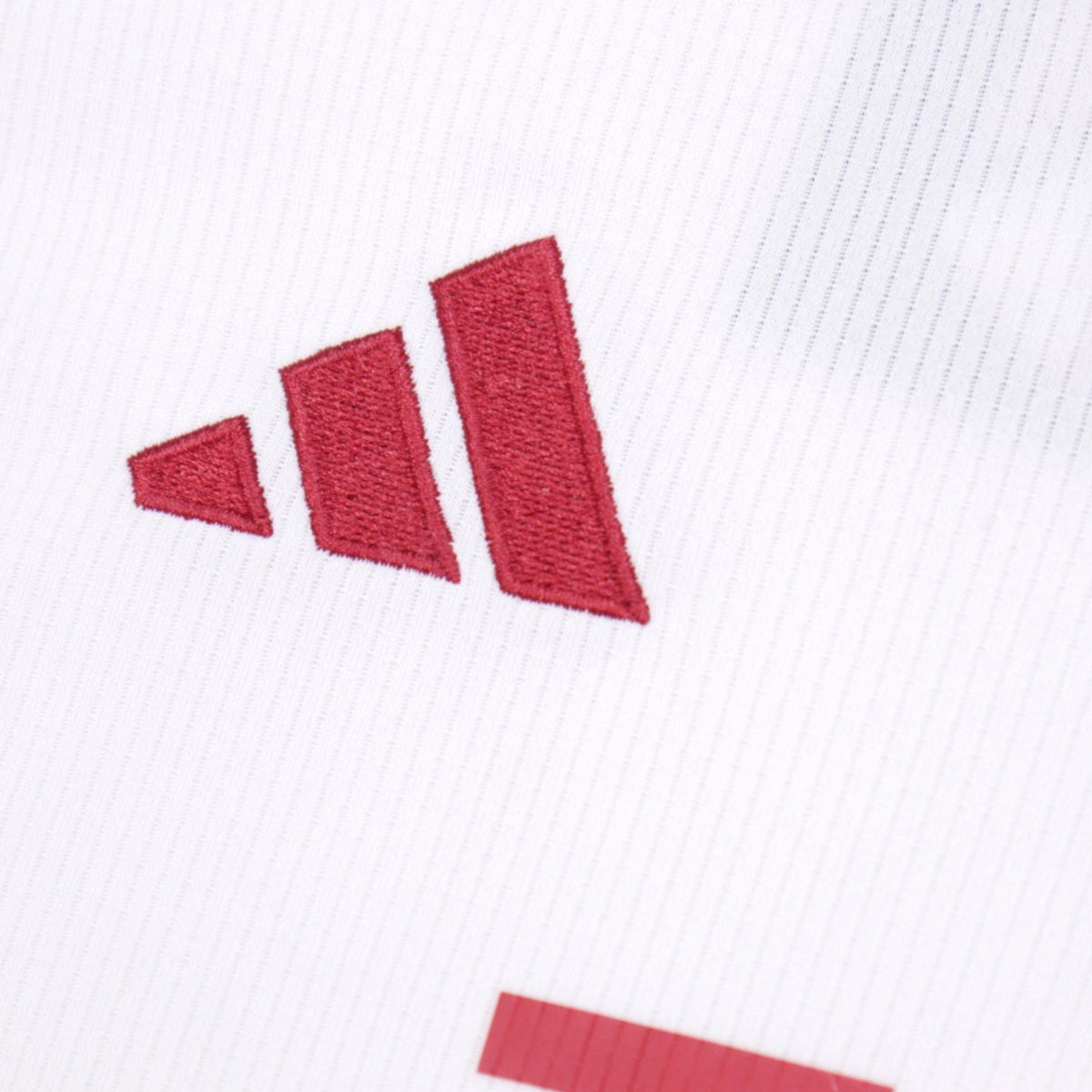 Close-up of adidas three-stripe logo on 2023/24 Manchester United third shirt