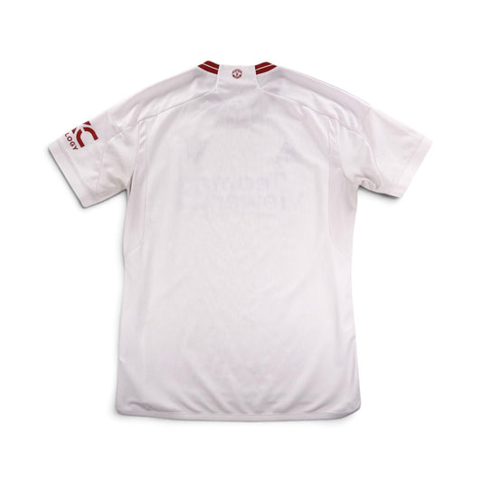 2023/24 Manchester United third shirt by adidas, back view showing plain white body with red trim