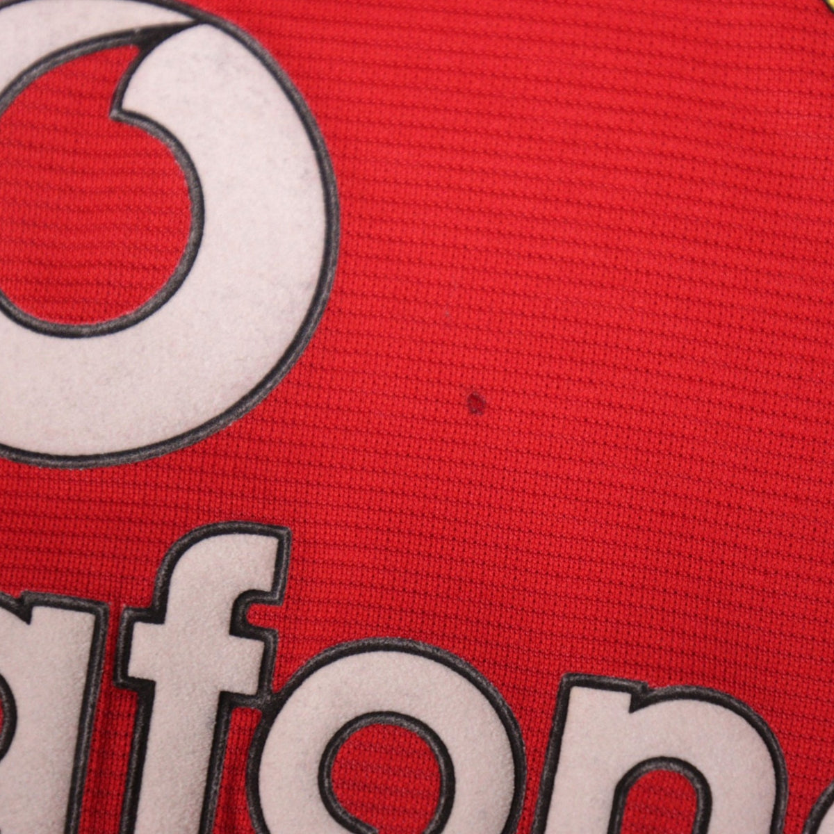 Close-up detail showing a small mark near the Vodafone lettering