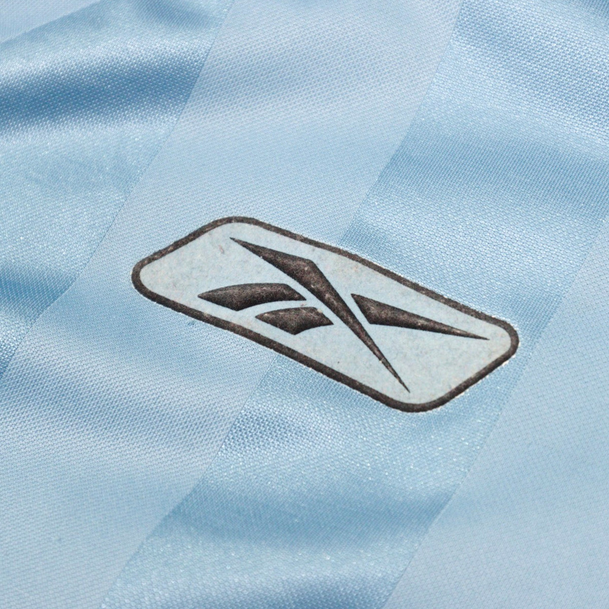Close-up of the Reebok logo on the chest