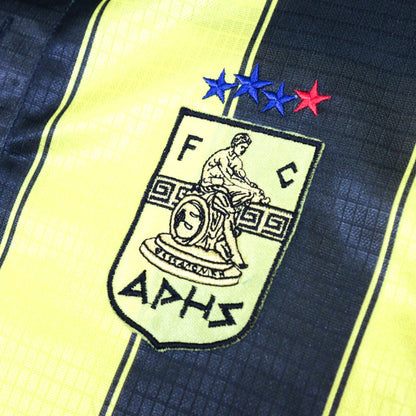 Close-up of Aris Thessaloniki crest with four stars above it