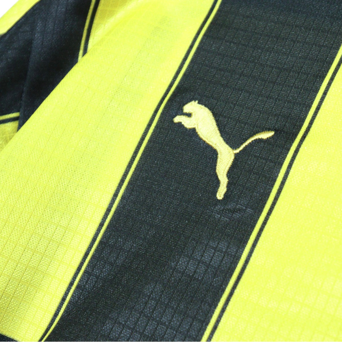 Close-up of Puma logo on the sleeve stripe