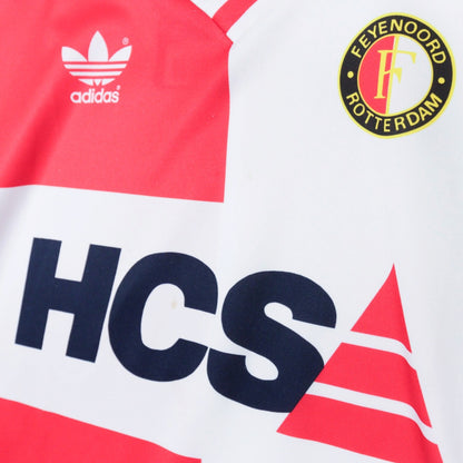 Close-up of adidas trefoil logo, Feyenoord crest and HCS sponsor on the chest