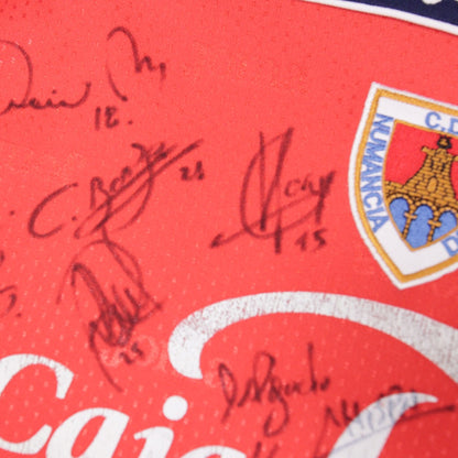 Close-up detail of signatures and Numancia crest