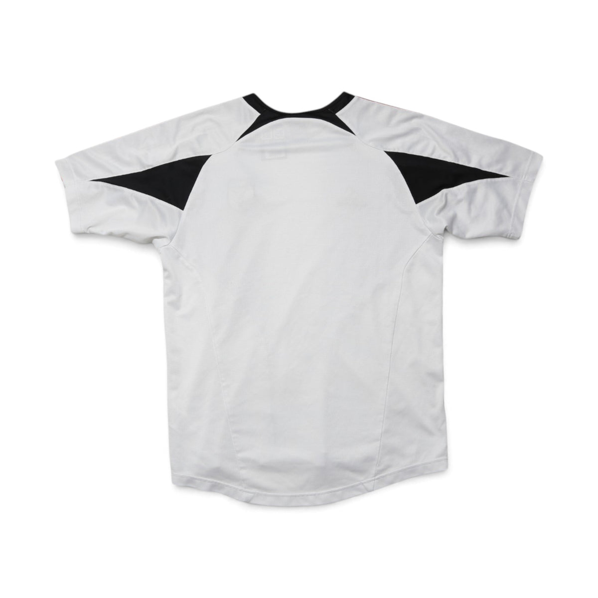 Close-up of DC United training shirt swing tag with price and barcode