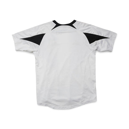 Close-up of DC United training shirt swing tag with price and barcode