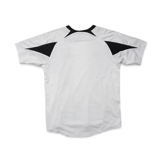 Close-up of DC United training shirt swing tag with price and barcode
