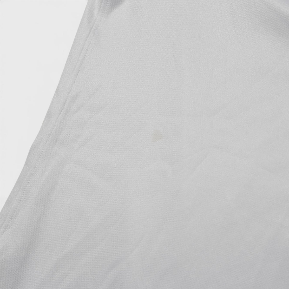 Close-up of DC United training shirt fabric showing a small mark