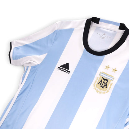 Close-up of Argentina shirt collar, adidas logo and AFA crest with two stars