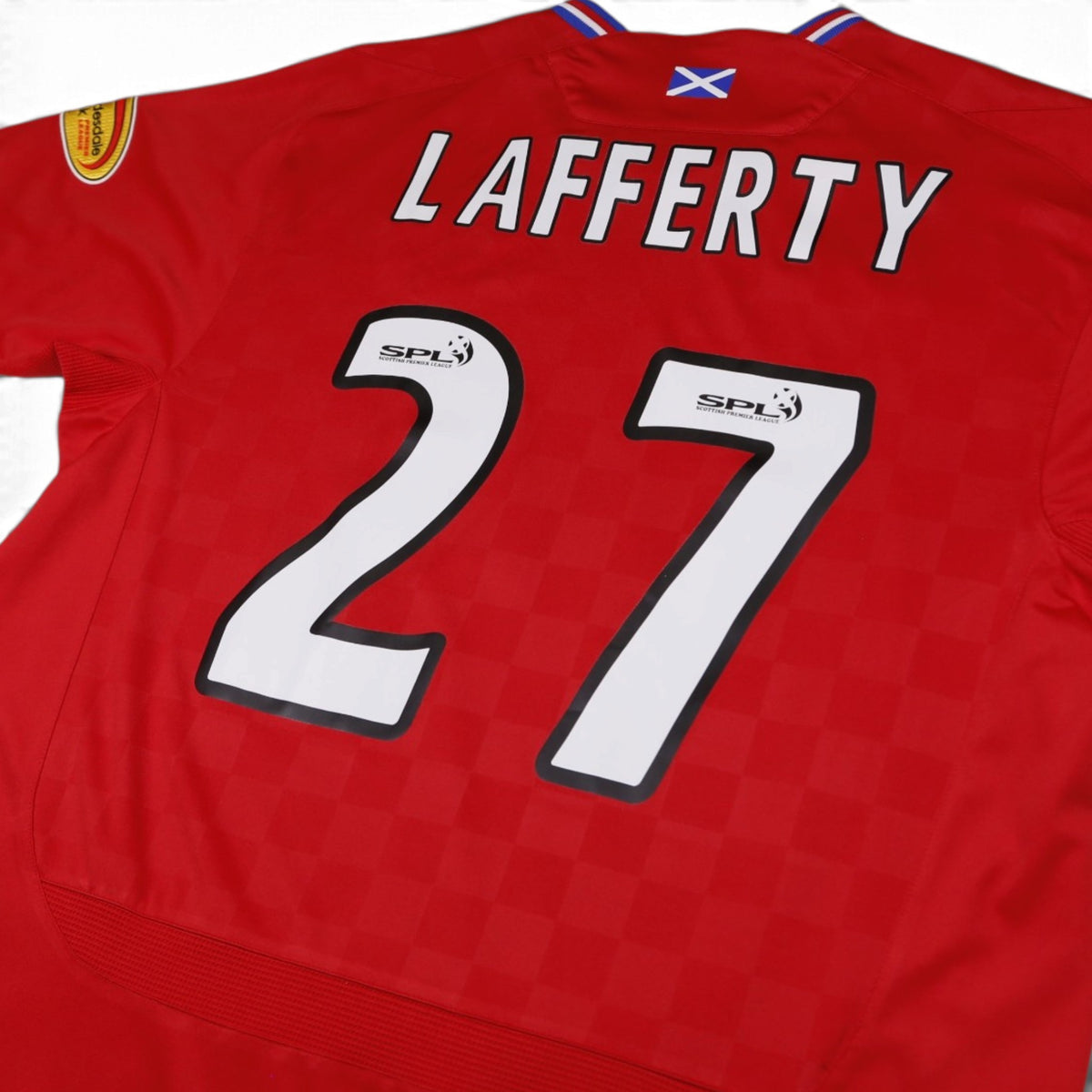 Close-up of Lafferty 27 name and number printing with SPL badge and Saltire detail