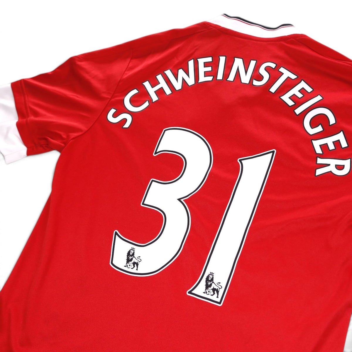 Close-up of Schweinsteiger 31 print and Premier League patches on shirt back