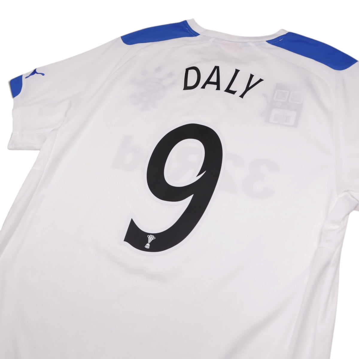 Close-up of Daly number 9 print on the back of the shirt
