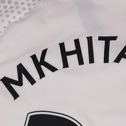 Close-up of the Mkhitaryan name print showing light surface cracking