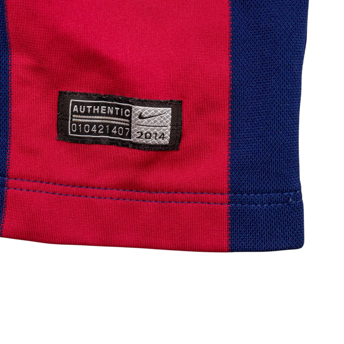 Close-up of the Nike Authentic hem label with 2014 date code
