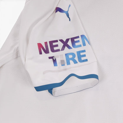 Close-up of sleeve showing Nexen Tire logo and blue cuff trim
