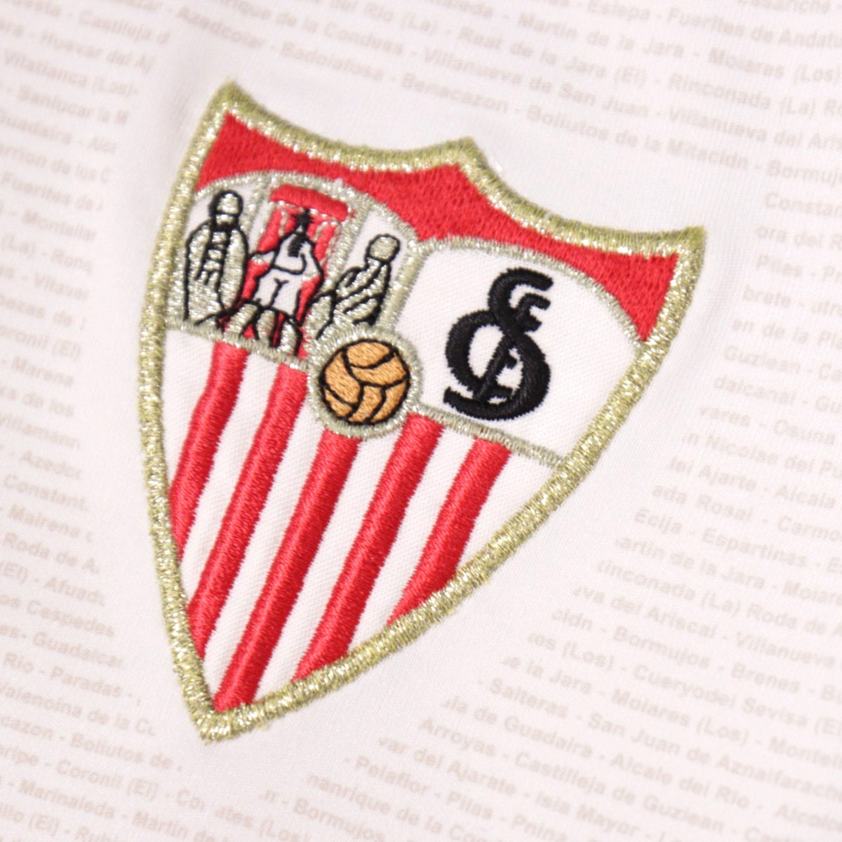 Close-up of the embroidered Sevilla crest