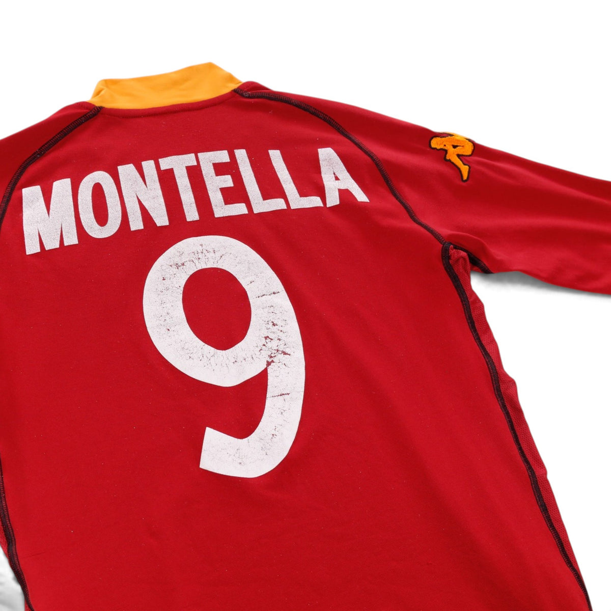 Close-up of Montella name and number 9 print on the back of the shirt