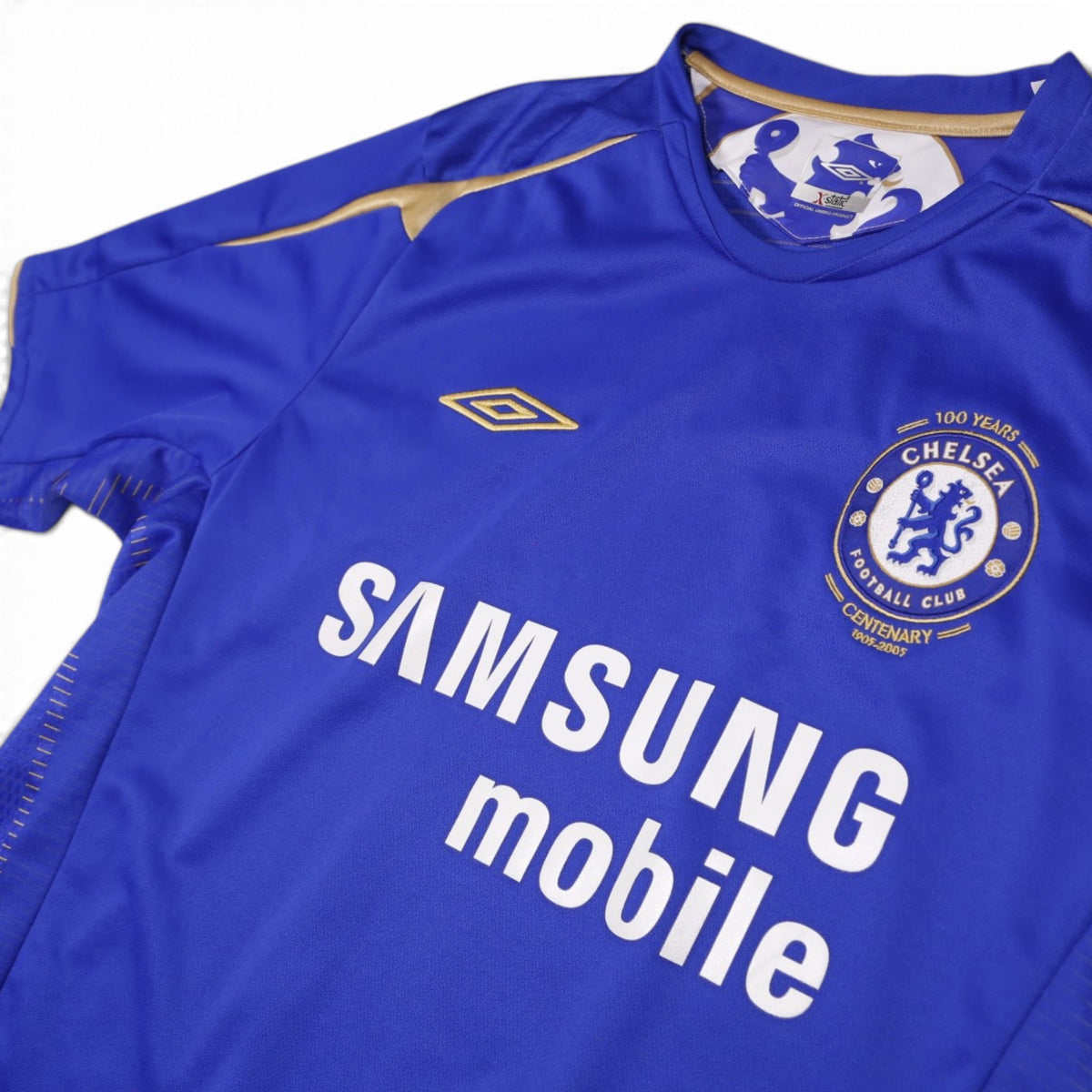 Close-up of Umbro neck label and Chelsea centenary crest