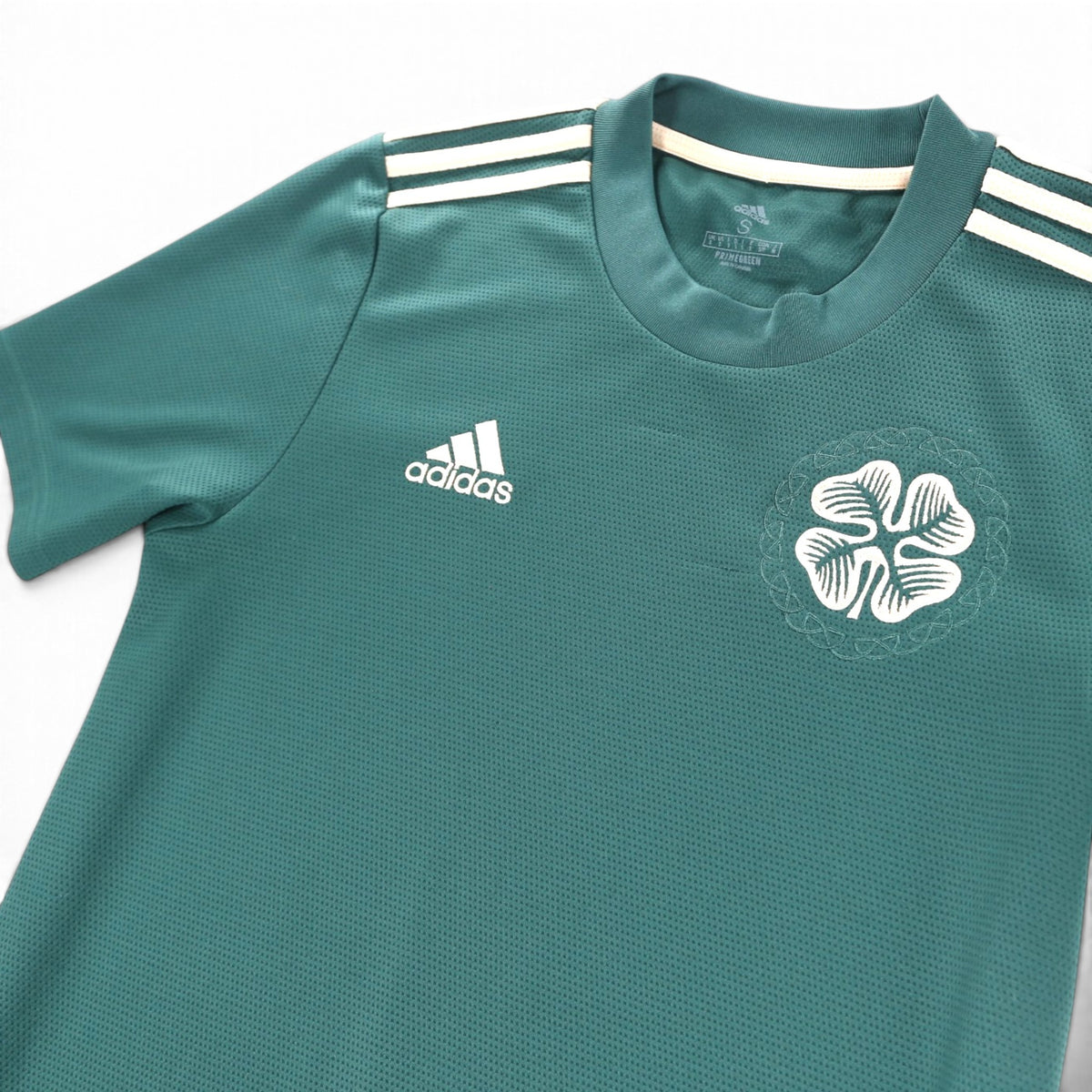 Close-up of adidas logo and Celtic crest on the chest of the 2021/22 away shirt
