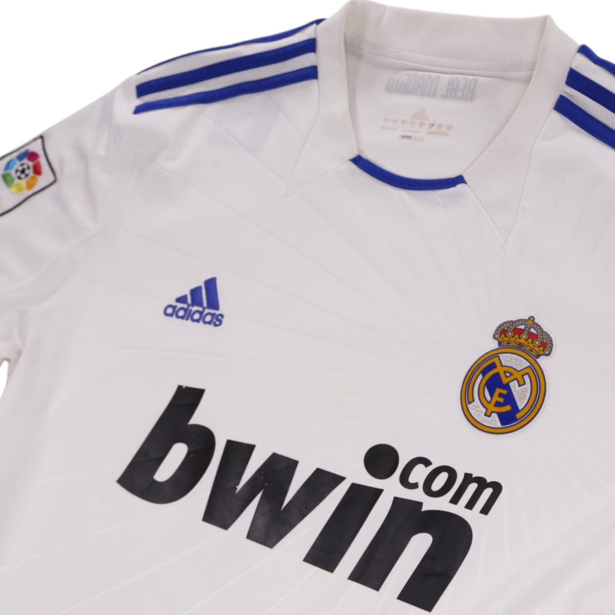 Close-up of Real Madrid crest, adidas logo and bwin.com sponsor on the chest