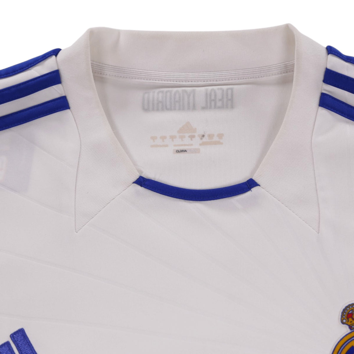 Close-up of the collar and neck label reading Real Madrid and adidas