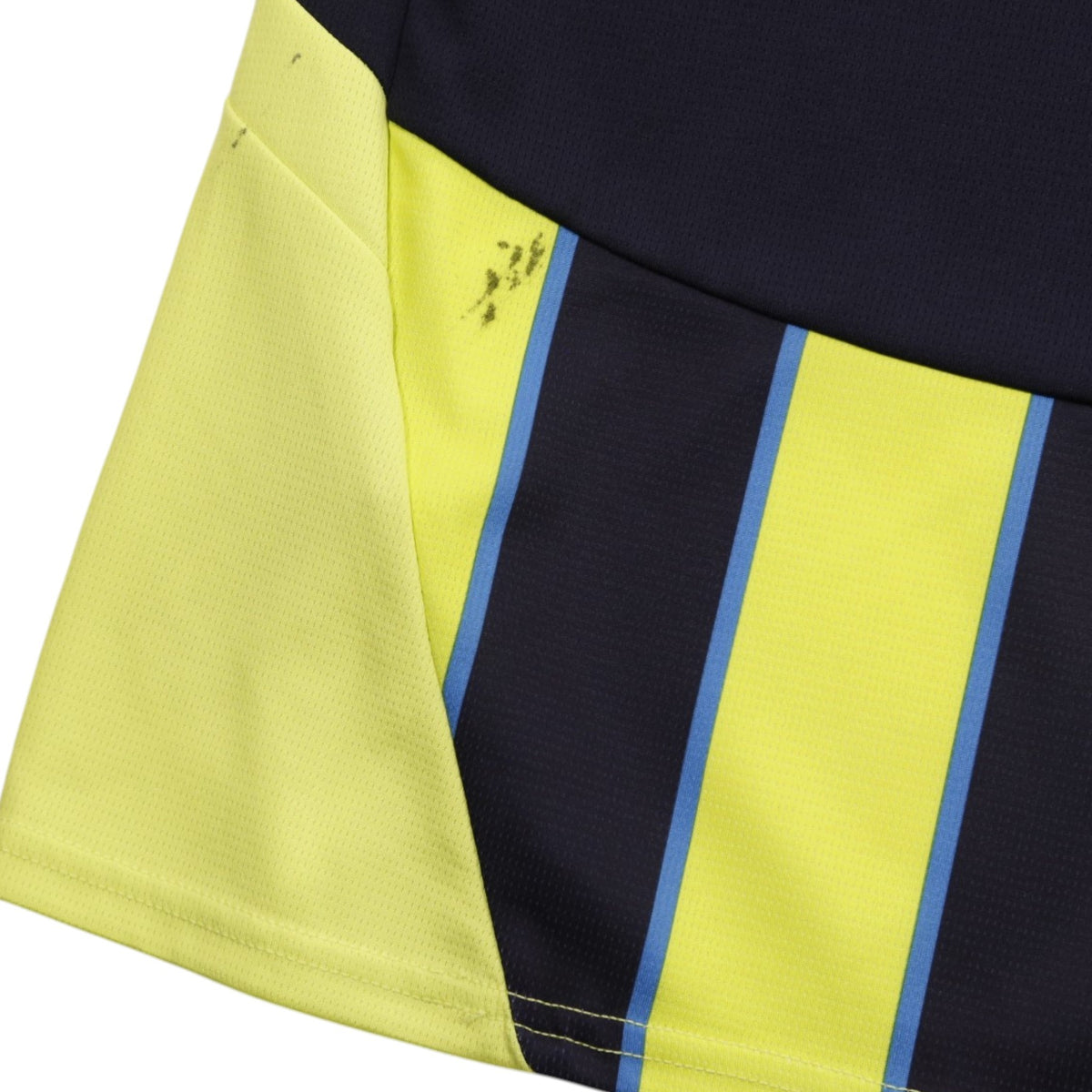 Close-up of yellow side panel showing marks near the hem