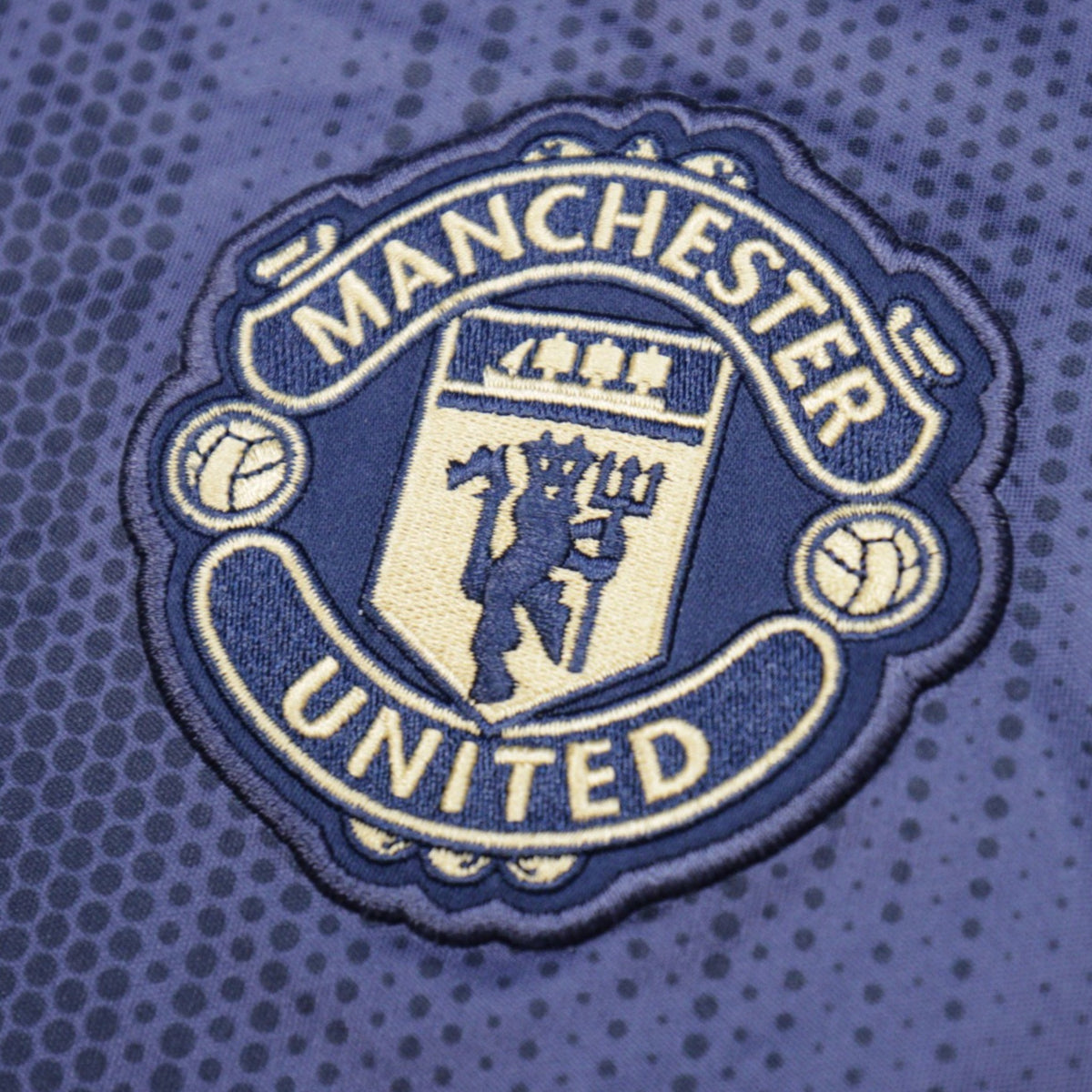 Close-up of the embroidered Manchester United crest