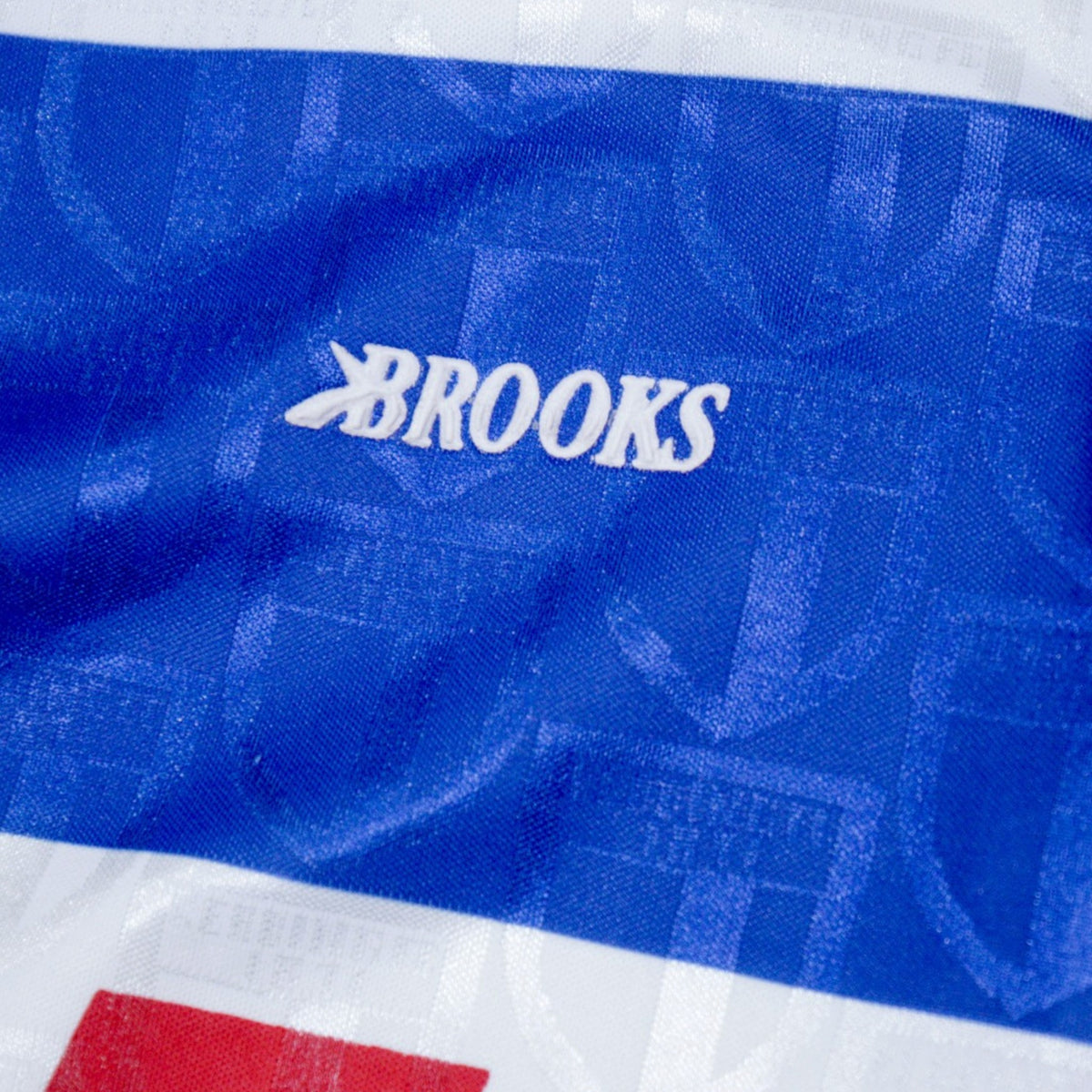 Close-up of the Brooks logo on the chest