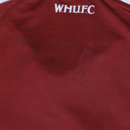 Close-up of W.H.U.F.C. lettering below the back collar