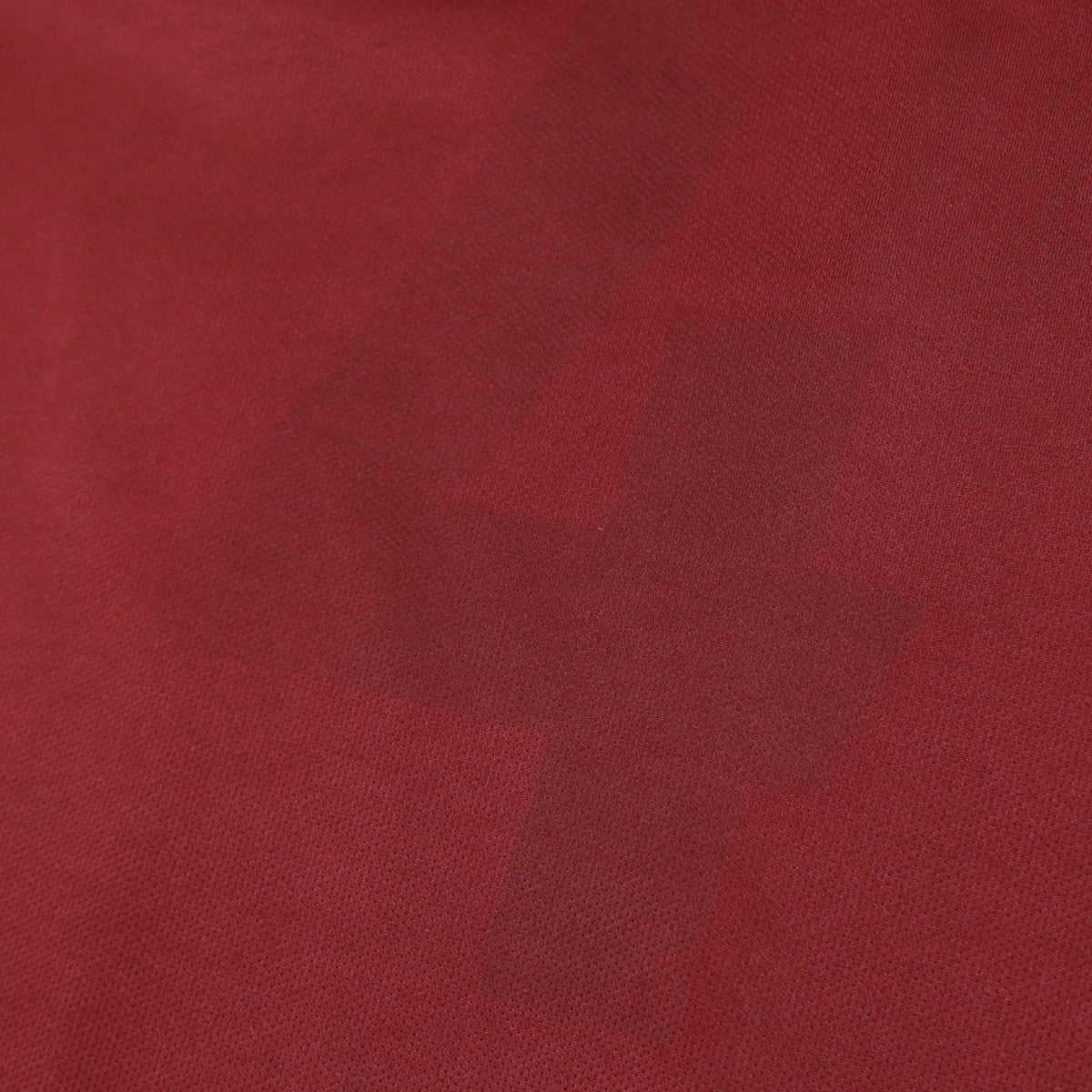 Close-up of the claret fabric texture on the West Ham United shirt