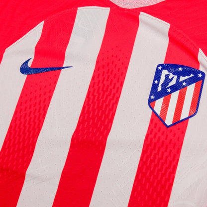 Close-up of the Nike swoosh and Atletico Madrid crest on the chest