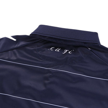 Close-up of Leeds United shirt collar with 'LUFC' script on the back neck
