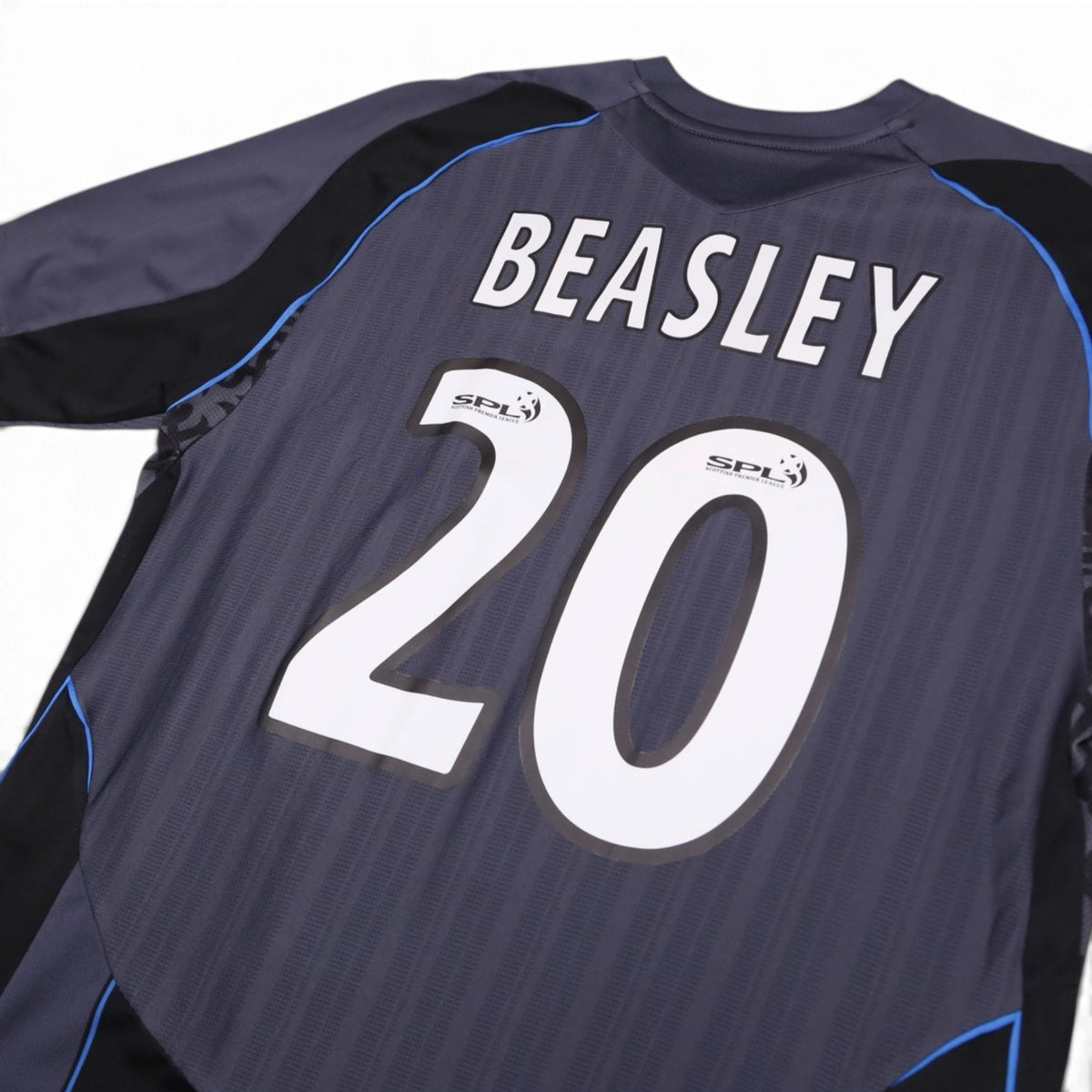 Close-up of Beasley 20 print and SPL sleeve patches on Rangers away shirt