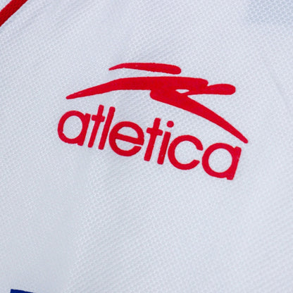Close-up of the Atletica manufacturer logo on the shirt