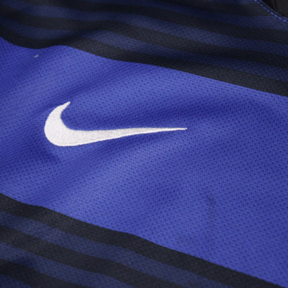 Close-up of Nike swoosh logo on sleeve fabric