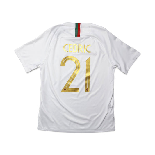 Back of 2018/19 Portugal away shirt showing Cedric #21 printed in gold lettering