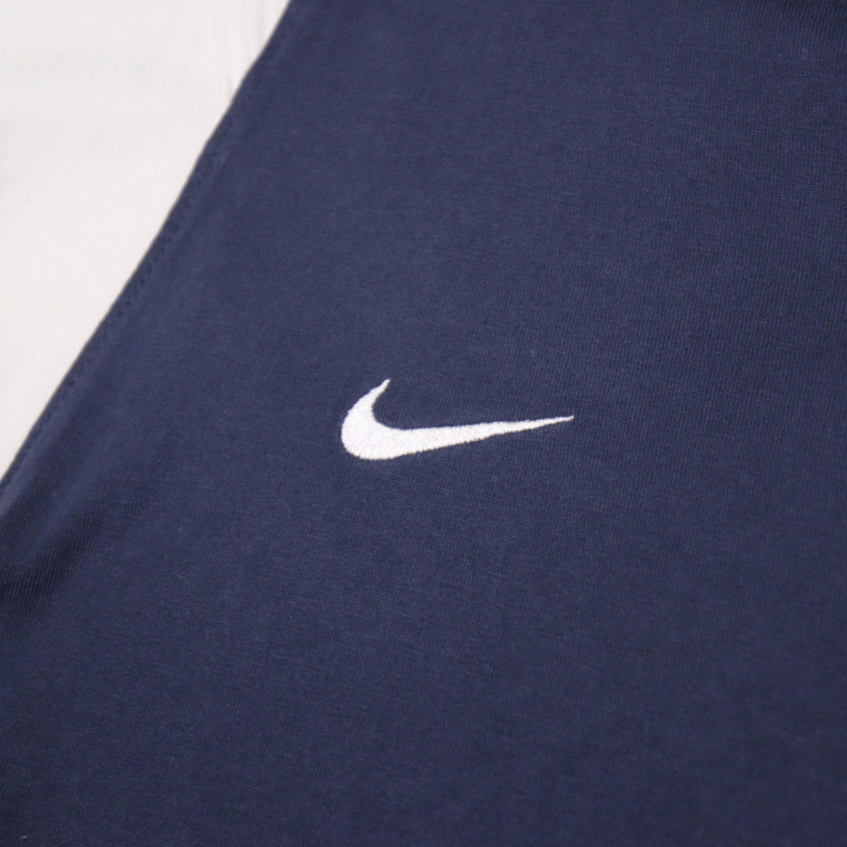 Close-up of the Nike swoosh embroidered on the chest