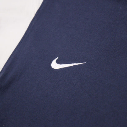 Close-up of the Nike swoosh embroidered on the chest