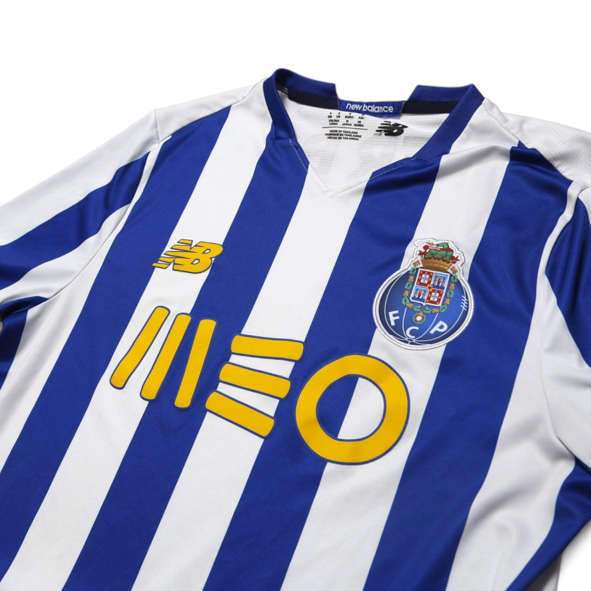 FC Porto shirt front detail showing New Balance logo, MEO sponsor and club crest
