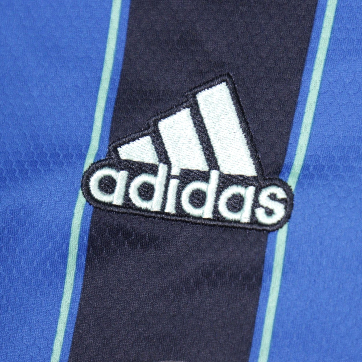 Close-up of adidas logo on Ajax away shirt sleeve