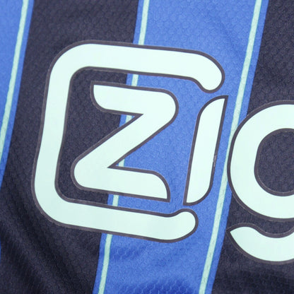 Close-up of Ziggo sponsor text on Ajax away shirt
