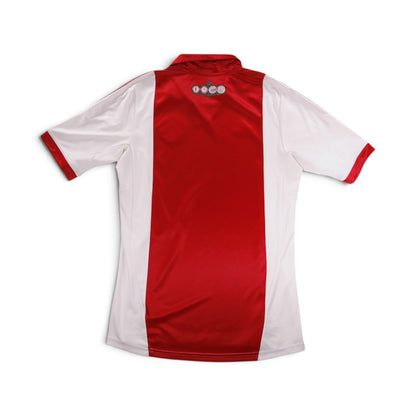 Ajax home shirt back detail showing club anniversary emblem below collar