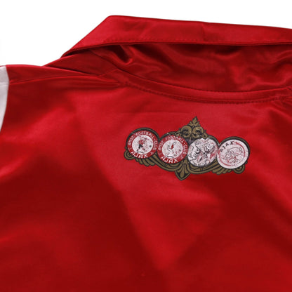 Close-up of club emblem print below the collar on the Ajax home shirt